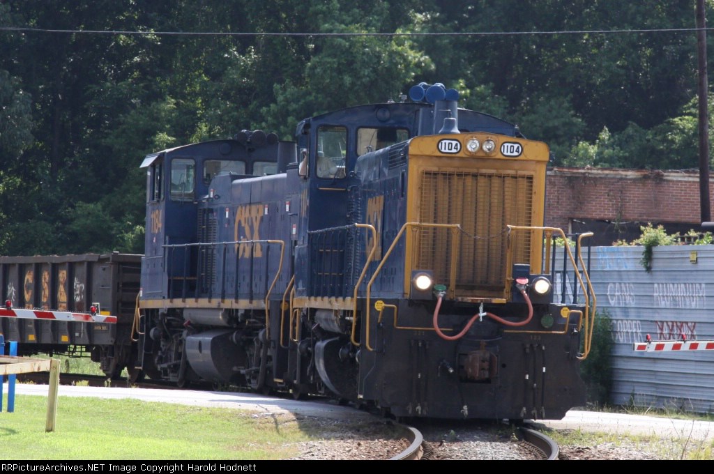 CSX 1104 & 1184 power a short train out of Bennett Yard